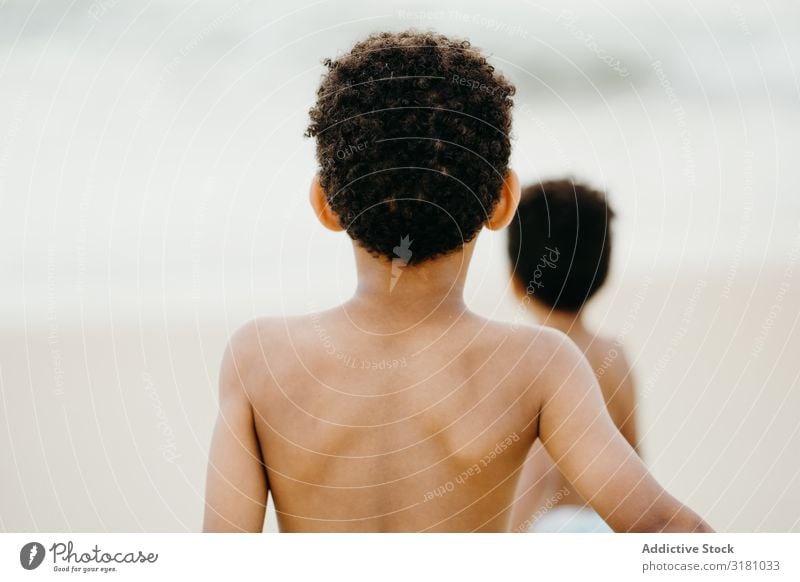 Black boys playing on beach brothers Beach Ocean Playing Joy Together Summer Water Boy (child) shirtless Barefoot Child siblings Happy Weekend Lifestyle