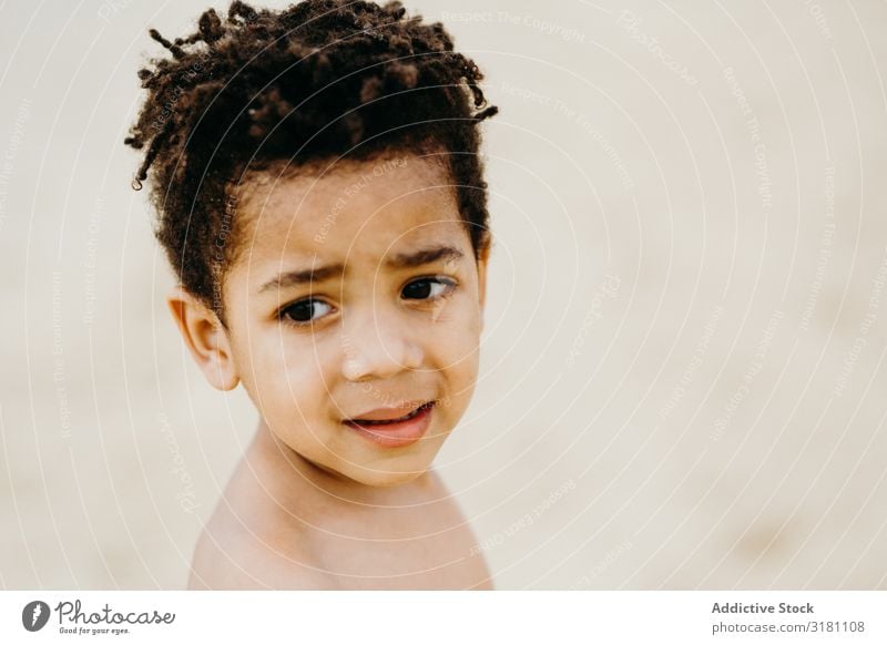 Funny black boy on beach Boy (child) Beach shirtless Looking away Summer Lifestyle Leisure and hobbies Child Black African-American Ethnic Coast Rest Relaxation