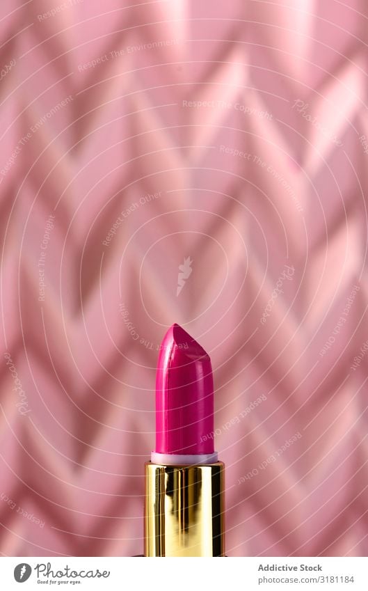 Lipstick on raised pink chevron. Product and make up concept Make-up Cosmetics Beauty Photography Background picture Pink Deserted Fashion Still Life Stick