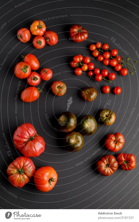 from above view of tomatoes on a black surface Background picture Plant Vegetable Deserted Fresh Juicy Agriculture Fruit Food Healthy Black Tomato