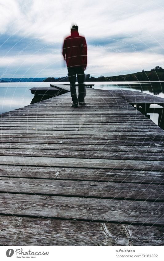 Alone at the jetty Contentment Relaxation Calm Freedom Man Adults 1 Human being Clouds Autumn Lakeside Movement Going Dream Wait Dark Sadness End Idyll Boredom