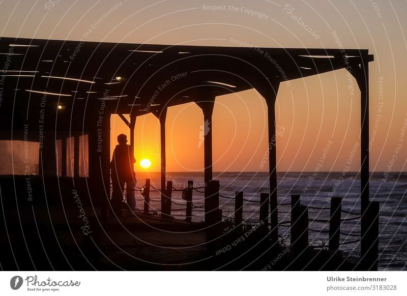 Couple in hug at sunset by the sea Man Woman Sunset evening mood Ocean Coast Terrace Evening Infatuation Love Together Sympathy Happy Emotions Embrace Warmth