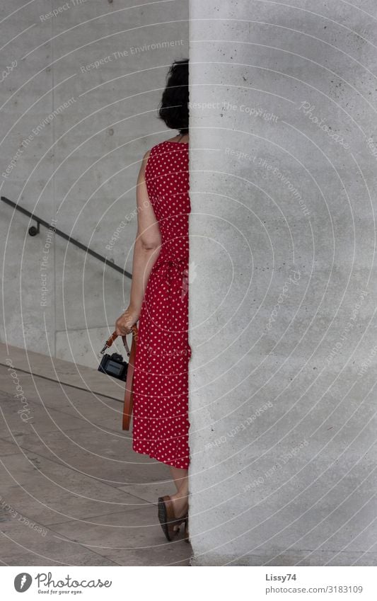 Woman in red Human being Feminine Adults 1 45 - 60 years Museum Summer Dress Spotted Brunette Short-haired Camera Red Life Colour photo Exterior shot