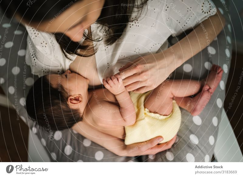 Mother feeding baby at home Appease Baby Home embracing Suck Considerate Newborn Love Child Parents Small Woman Embrace Bonding tender Harmonious Idyll Innocent