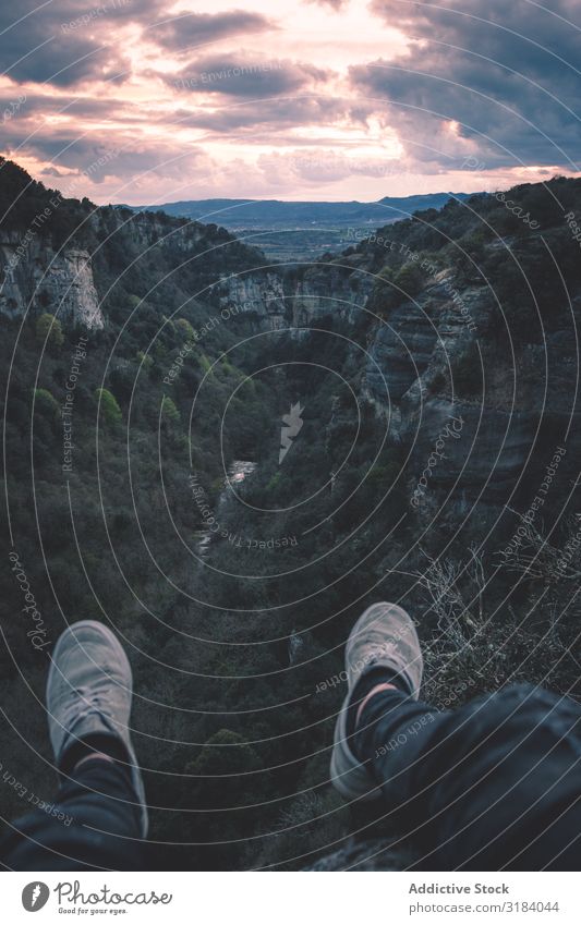 View to small river in canyon and legs of person sitting on the edge Canyon River Landscape Human being Legs Crops Unrecognizable body part Nature