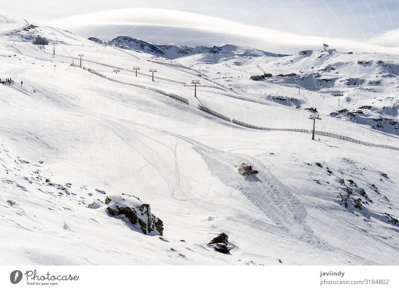 Ski resort of Sierra Nevada in winter, full of snow. Beautiful Vacation & Travel Tourism Winter Snow Mountain Sports Skiing Nature Landscape Sky Building Bright