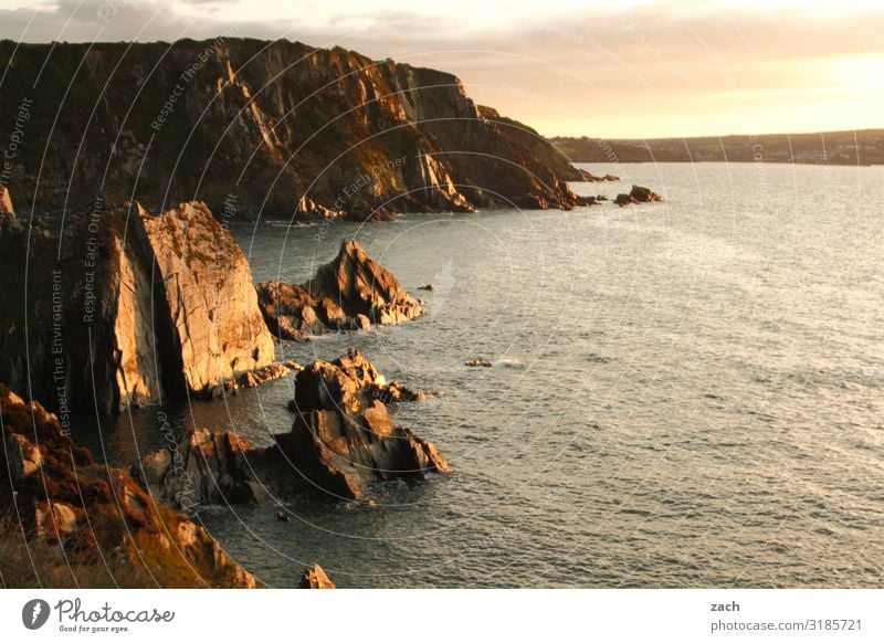 At the end of the day. Landscape Water Sunrise Sunset Beautiful weather Hill Rock Waves Coast Ocean Island British Isles Great Britain Wales Irish Sea