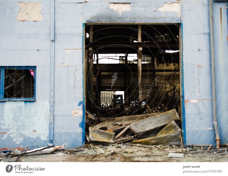 burnt-out warehouse Ruin Warehouse Wall (building) Goal Tracks Trademark Concrete Authentic Dirty Broken Gloomy Blue Disaster Apocalyptic sentiment Transience