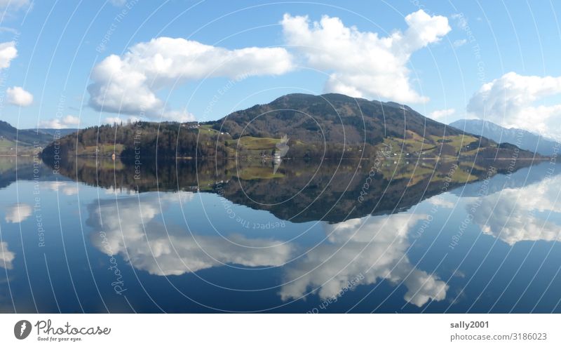 The lake rests still. Landscape Clouds Winter Beautiful weather Hill Alps Mountain Lakeside moon lake Esthetic Gigantic Natural Contentment Symmetry