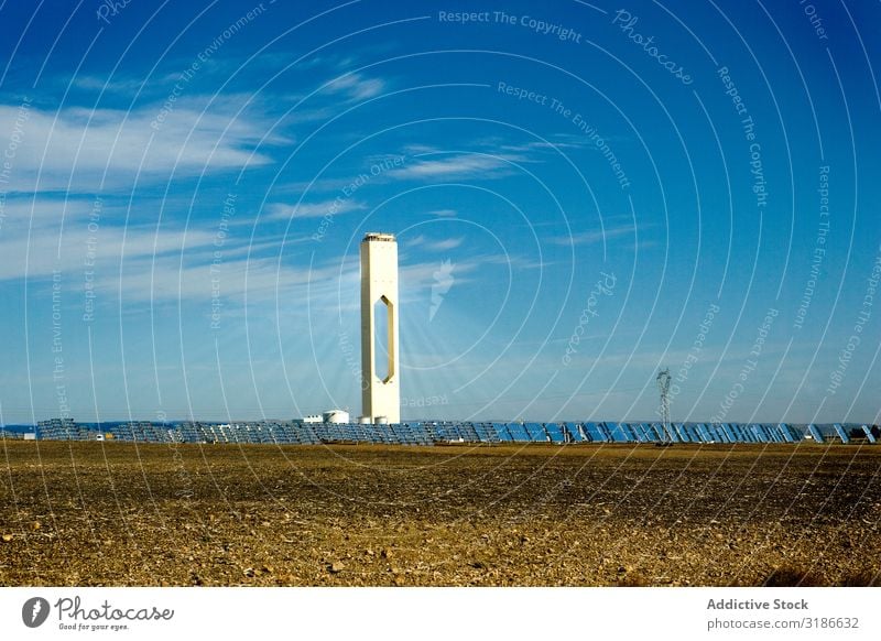 Tall tower in photovoltaic power station Solar Power Panels Station Tower Sky Clouds Sunbeam Day Energy Electricity Technology Building Weather Ecological