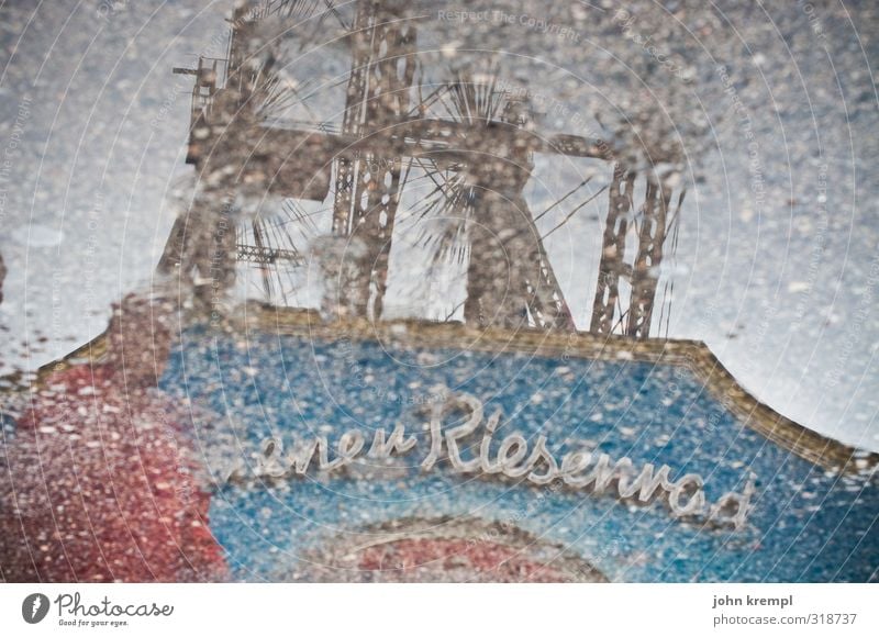 graphic | round trip Rain Puddle Vienna Capital city Tourist Attraction Landmark Ferris wheel Prater Famousness Historic Kitsch Retro Blue Gray Red Romance