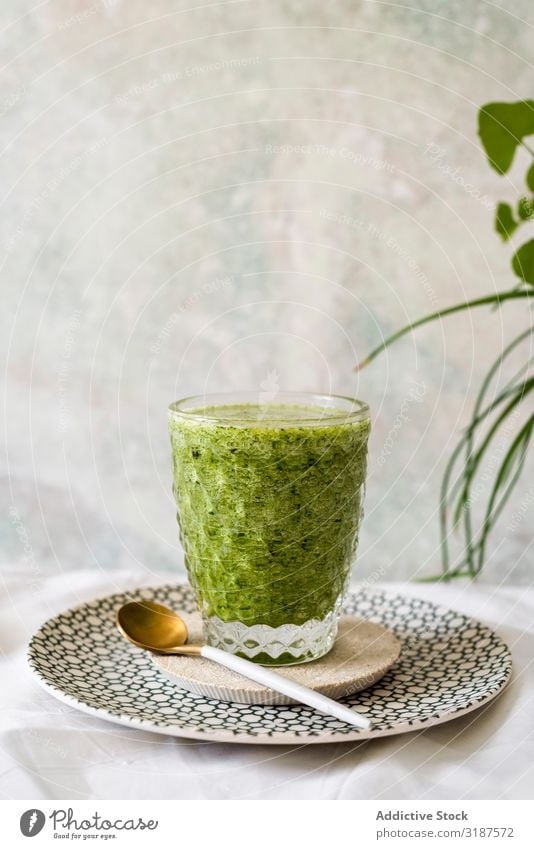 Healthy green smoothie detox Green Milkshake Detox Juice Drinking Spinach Food Fruit Vegetable Avocado Apple Vegetarian diet Organic super food Close-up Glass