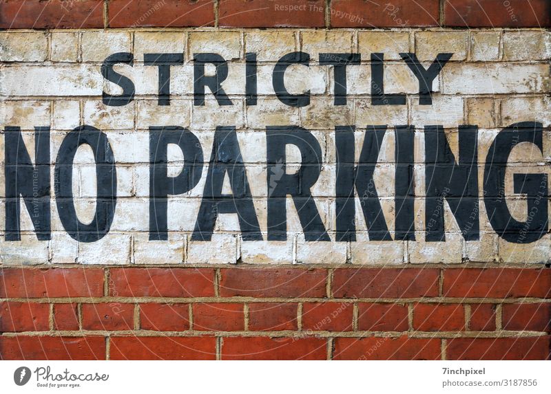 Do not park here Clearway Wall (barrier) writing Red White Black Wall (building) Exterior shot Deserted Copy Space bottom Stone interstices Characters Facade