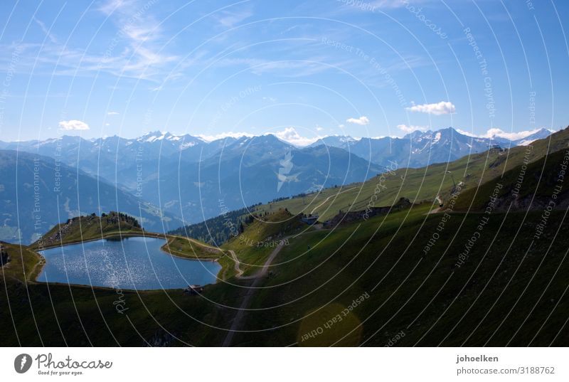 Pond in the Alps Lake reservoir Mountain alpine meadow Sky Deserted Copy Space fair weather clouds Blue sky Zillertaler Alps mountain panorama Panorama (View)