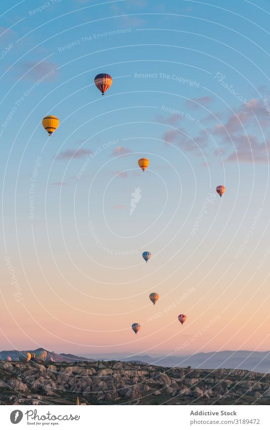 Hot air balloons against sunset sky Hot Air Balloon Festival Sunset Sky Clouds Mountain Dune Flying Cappadocia Turkey Vacation & Travel Adventure Transport Trip