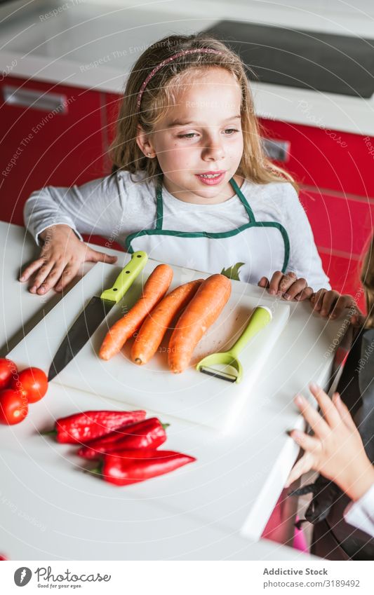 Siblings preparing vegetables for salad siblings Vegetable Kitchen Cooking Peeling cutting Salad Home Girl Boy (child) Vegan diet Healthy Fresh Child Sister