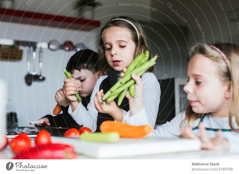 Siblings preparing vegetables for salad siblings Vegetable Kitchen Cooking Peeling cutting Salad Home Girl Boy (child) Vegan diet Healthy Fresh Child Sister