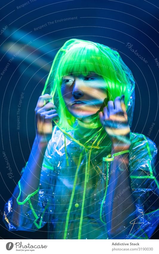 Asian woman posing in fluorescent light Woman Posture Fluorescent Light Youth (Young adults) asian Lifestyle Model Future Disco Fashion Glow Neon Beautiful