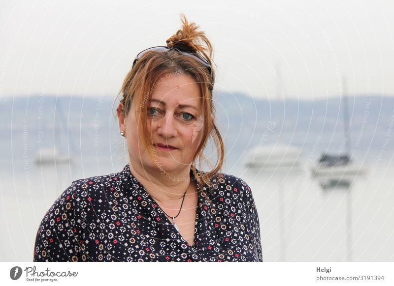 Portrait of a woman with long hair pinned up against a foggy background Human being Feminine Woman Adults Head Hair and hairstyles Face 1 45 - 60 years