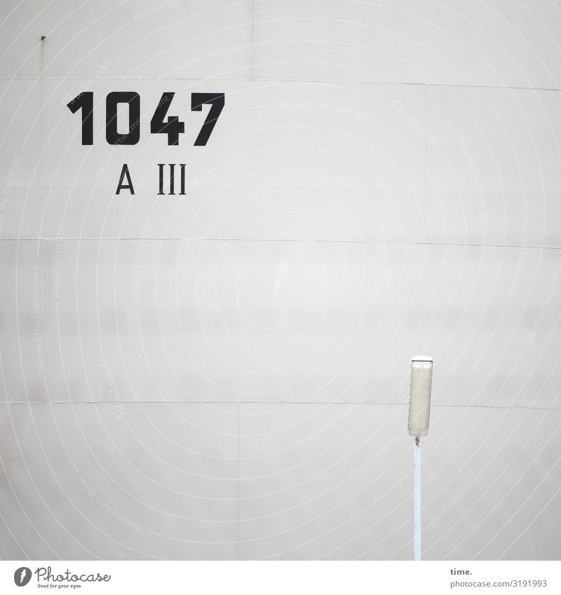 arithmetical problem Manmade structures Building Wall (barrier) Wall (building) Street lighting Lamp Concrete Sign Characters Digits and numbers