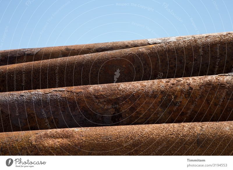 Metal dormant Sky Denmark Line Lie Blue Brown Black Emotions Iron-pipe Rust Stack Colour photo Exterior shot Deserted Day Light Shadow Contrast