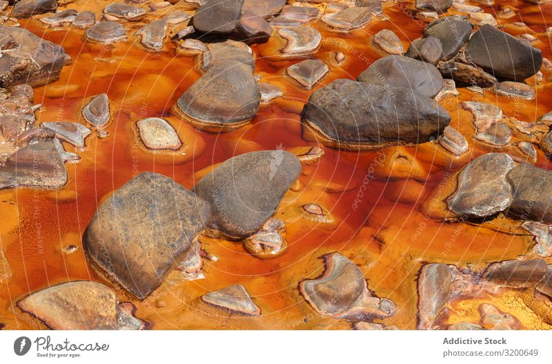 Bright orange splashes in nature Transition Background picture Mountain Abstract Rock geological Orange Stream Stone Yellow Beautiful Natural scenery