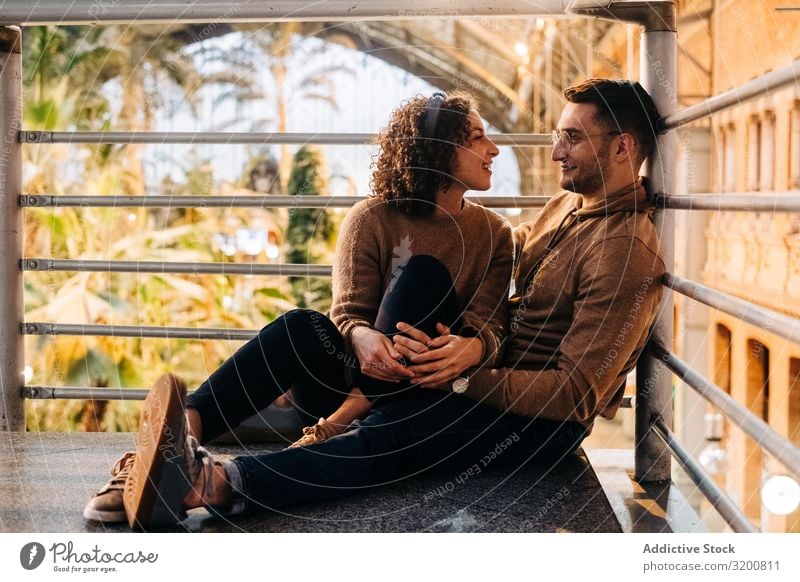 Happy couple hugging in pavilion Couple Embrace Date Pavilion looking at each other Youth (Young adults) City Love romantic Man Woman Together girlfriend