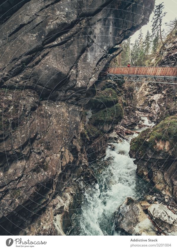 Bridge of tourist path among beautiful mountains Tourist Lanes & trails Mountain Beautiful hiker enjoying Vantage point Majestic Landscape Picturesque Alps