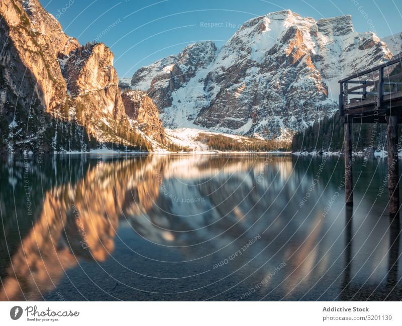 Amazing serene mountains and lake landscape in daylight Landscape Serene Reflection Break water Nature Ocean Rock Coast Water Beach Vacation & Travel Tourism