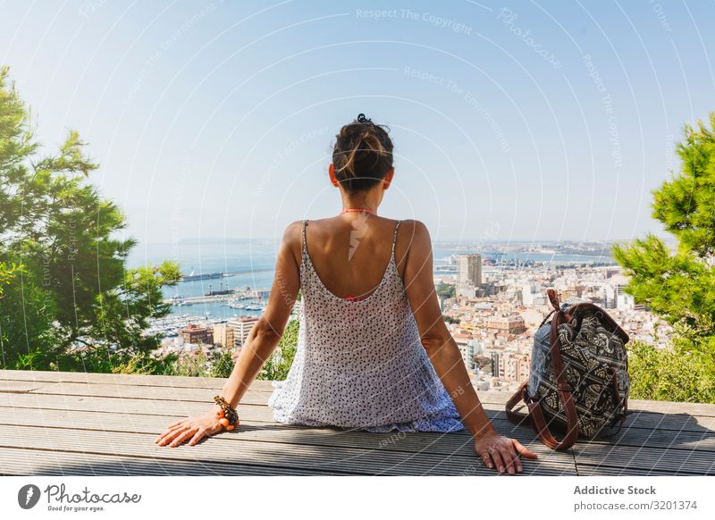 Woman on bench looking at city views from above Skyline breathtaking City Sightseeing Bench Vacation & Travel Youth (Young adults) Beautiful High-rise Trip