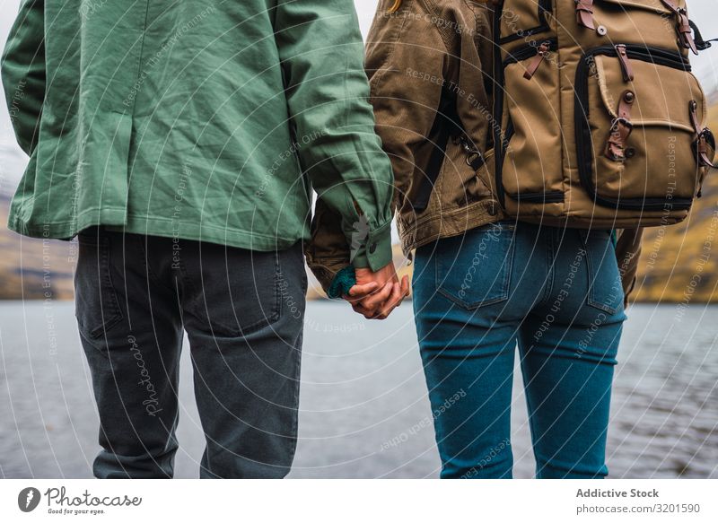 couple holding hands in front a lake in Faroe Island Man Human being Exterior shot Happy Cheerful Life Considerate Hold Happiness Caucasian Romance