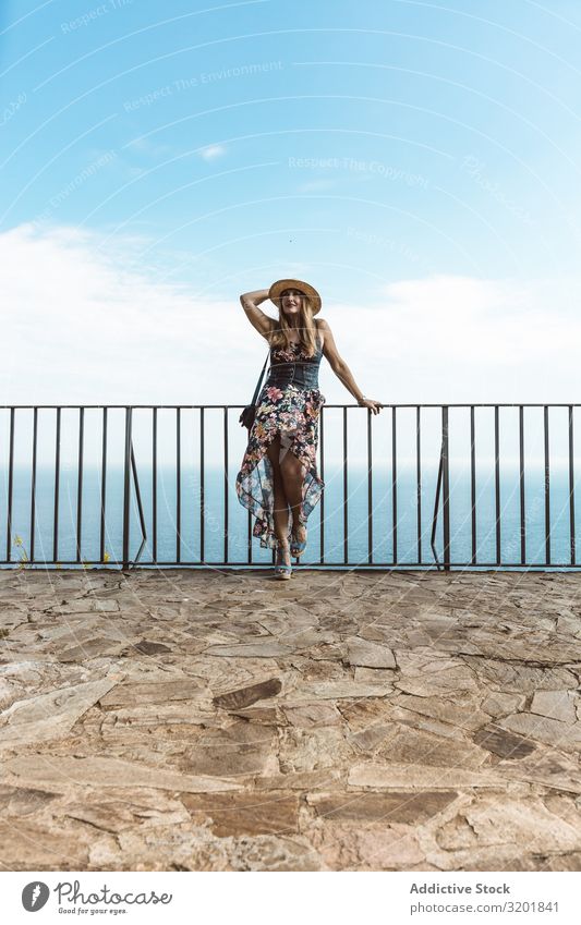 Stylish woman on terrace of seashore Woman seascape Style Summer Terrace Modern Fence Coast Vacation & Travel Contentment Leisure and hobbies Beautiful Idyll