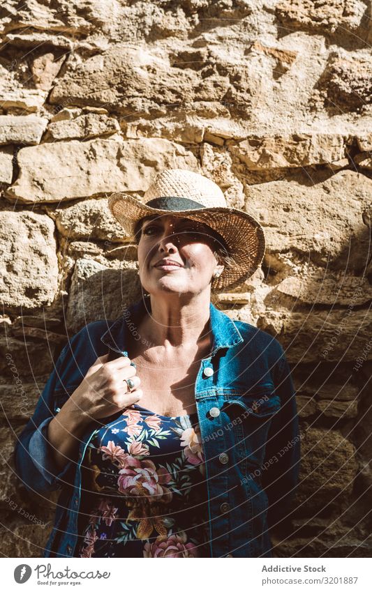 Woman leaning in a wall in village Beautiful Dress Fashion Girl Happy Hat Lifestyle Exterior shot Human being Street Style Summer Tourism Tourist Town