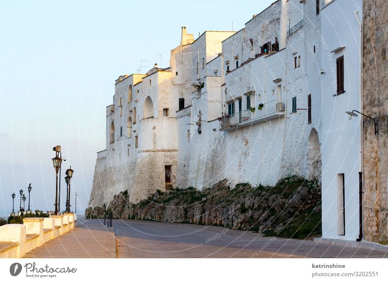 Outside white walls of the City of Ostuni, Apulia, Italy Vacation & Travel Town Building Architecture White Sunset painted città bianca white town