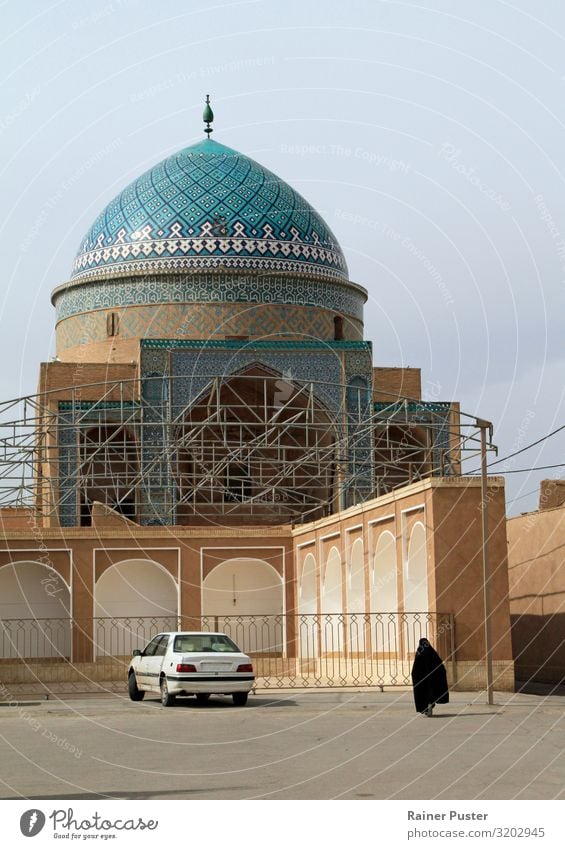 Street scene in Tehran, Iran Woman Adults 1 Human being Town Downtown Mosque Burka Exotic Blue Brown Turquoise Secrecy Serene Calm Wanderlust Packaged