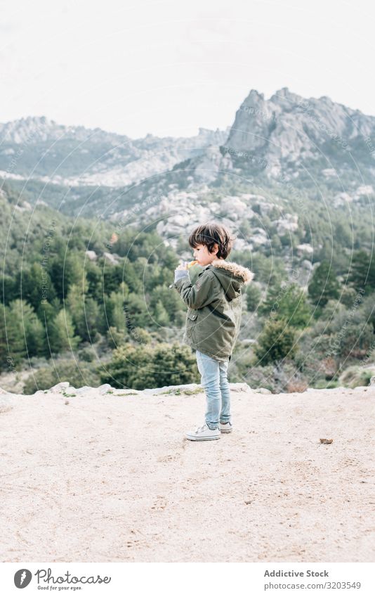 Boy walking on rocky hill Boy (child) Nature Hill To go for a walk Walking Rock Vacation & Travel Child Recklessness Landscape Downward Adventure Action Infancy