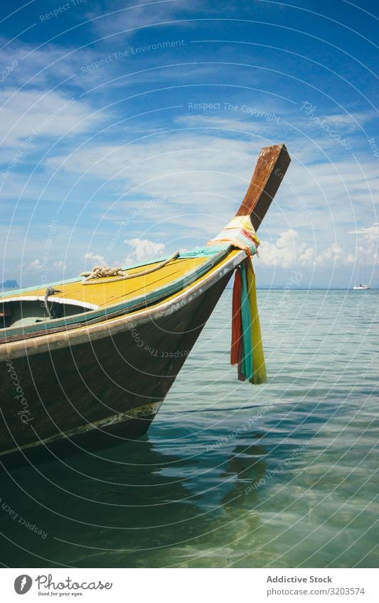 Floating boat in peaceful clear water Watercraft Tropical Float in the water Coast Thailand Tradition Ocean Vacation & Travel Transport Lagoon Beautiful Tourism