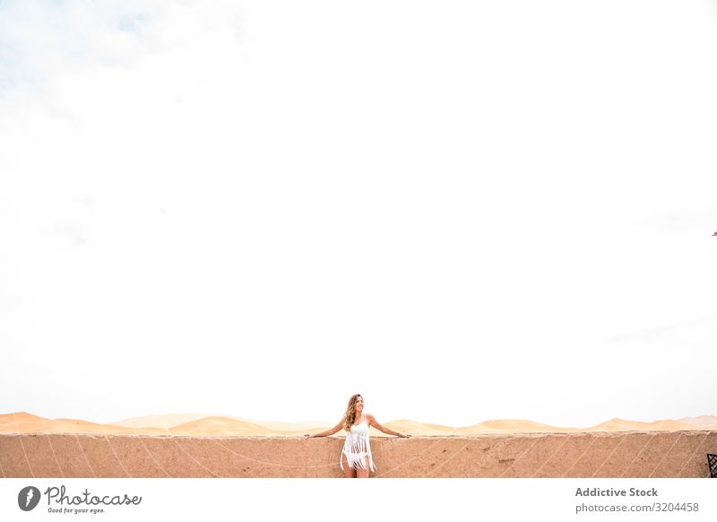 Woman on terrace against desert landscape Desert Terrace Morocco Vacation & Travel To enjoy Lean Balcony Landscape Nature White Summer Fresh Beauty Photography