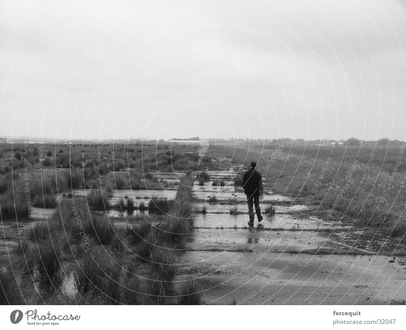 Walking on a disused airfield lonely solitude walk