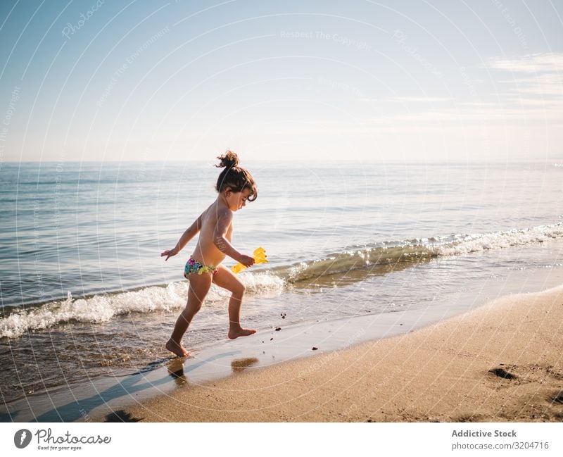 Toddler girl walking on sandy beach Girl Beach Walking Playing Child Swimming Sand Ocean Calm Infancy Summer Vacation & Travel Sunbeam Water seaside Coast