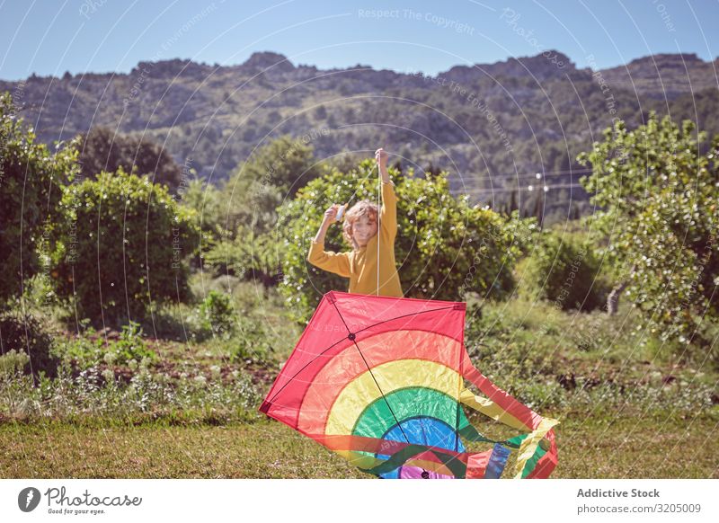 Boy launching kite on summer day Boy (child) Kite Sky Joy Infancy Playing Flying Landscape Child Small Human being Action Playful Easygoing Recklessness