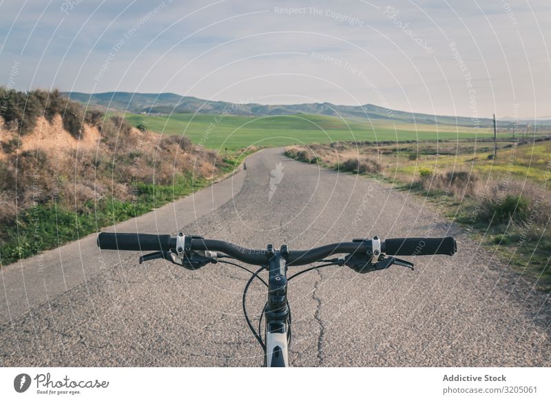 Bicycle on road in desert hills Street Empty Desert Hill Landscape Sand Stone Plant Trip Dry Nature Sky Vacation & Travel Hot Destination exploring