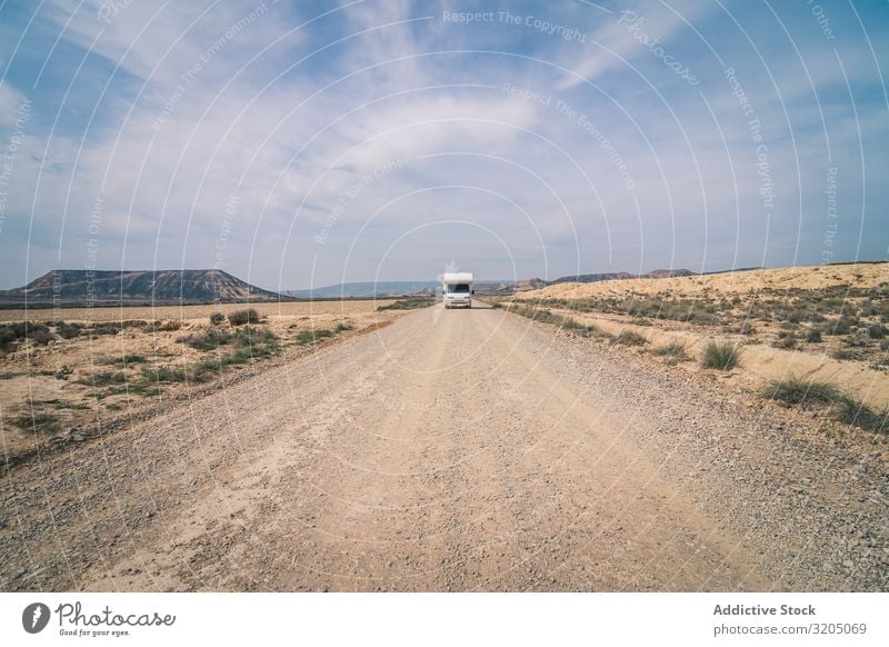 White trailer on empty road along desert Trailer Desert Amazing Empty Street Vacation & Travel Caravan Landscape Nature Speed Asphalt Trip semi Adventure