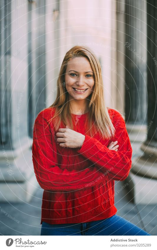 Stylish female standing near marble columns Woman Portrait photograph Happy Looking into the camera Street City Youth (Young adults) Column Style Building