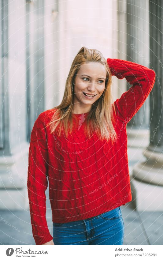 Stylish female standing near marble columns Woman Portrait photograph Happy Looking away Street City Youth (Young adults) Column Style Building Marble Sweater