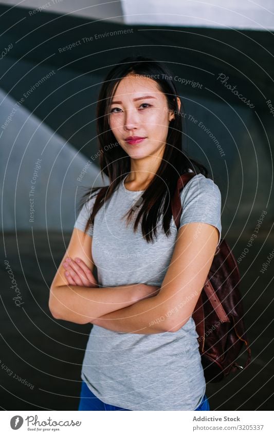 Confident Asian woman looking at camera Woman Cheerful Positive crossed arms Smiling asian Town Easygoing Youth (Young adults) Happy Underground Passage City