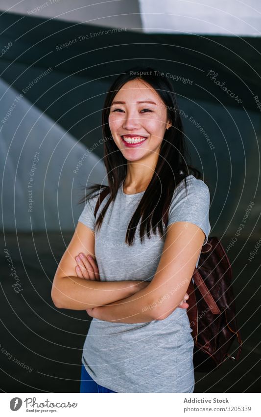 Cheerful Asian woman looking at camera Woman Positive crossed arms Smiling asian Town Easygoing Youth (Young adults) Happy Underground Passage City toothy