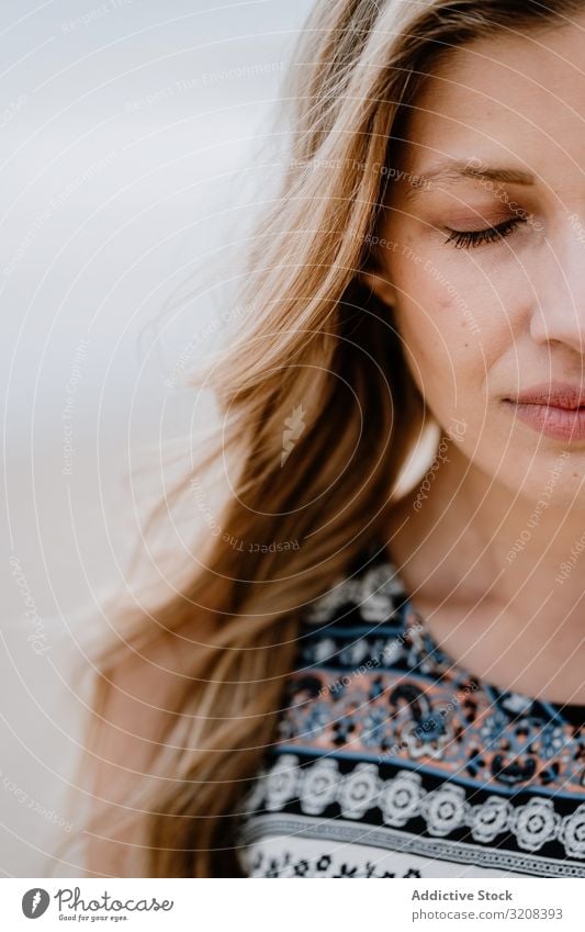 Beautiful young woman with closed eyes half face portrait beauty close-up imagination thinking fashionable crop view glamorous summer female person attractive