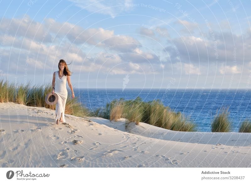 Woman walking sandy hill woman picturesque motion energy summer landscape dune desert scenic sunset tarifa cadiz spain nature female travel vacation tourism