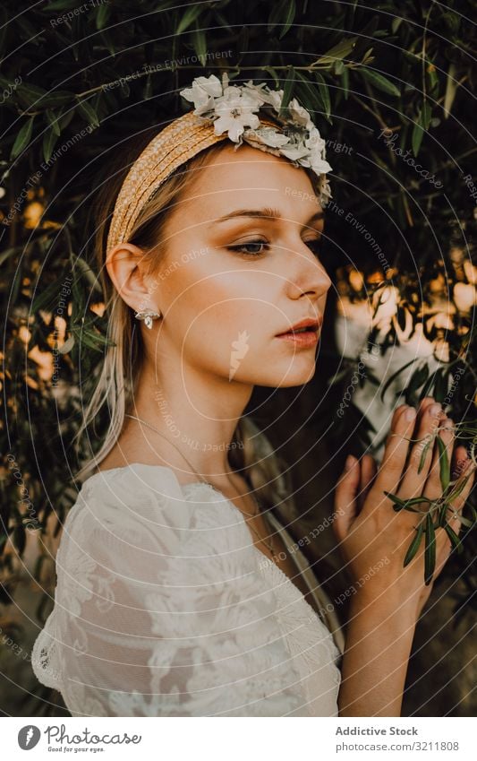 Charming woman in elegant dress with flowers near tree bride boho lace wreath dream style tender sensual natural summer romantic wedding blonde hippie lifestyle